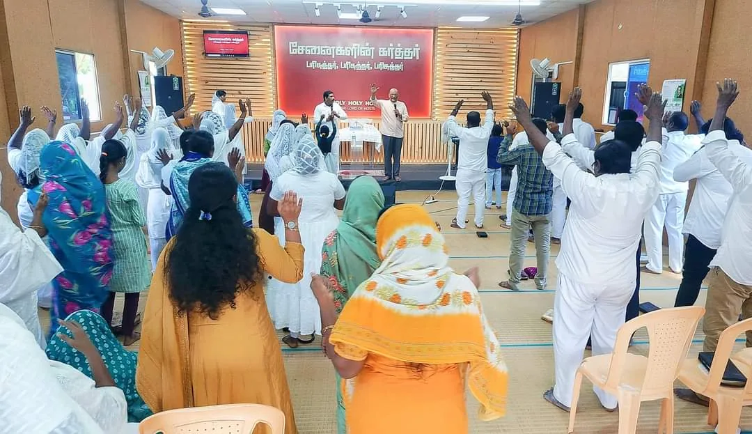 A congregation worshipping during a service in India