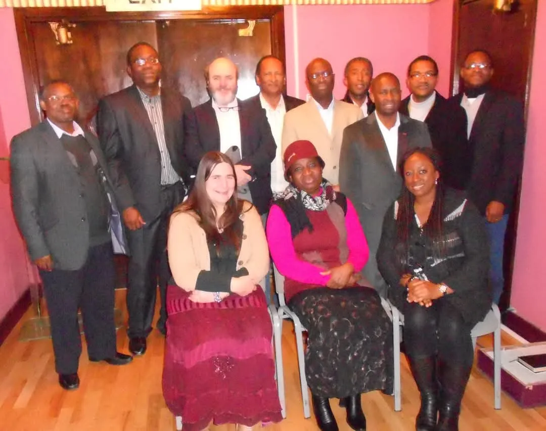 Abel Govender with a church leadership team in the United Kingdom