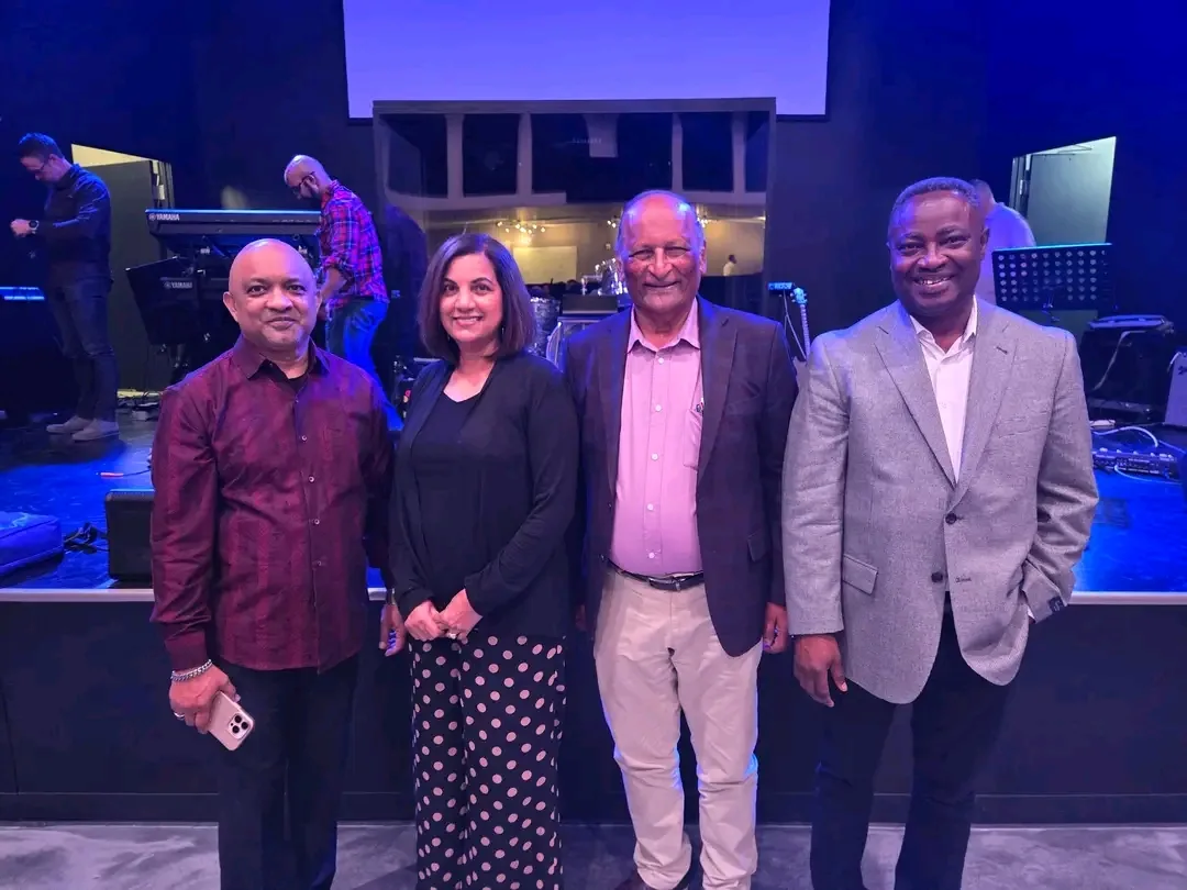 Abel Govender with church leaders at a gathering in the United States