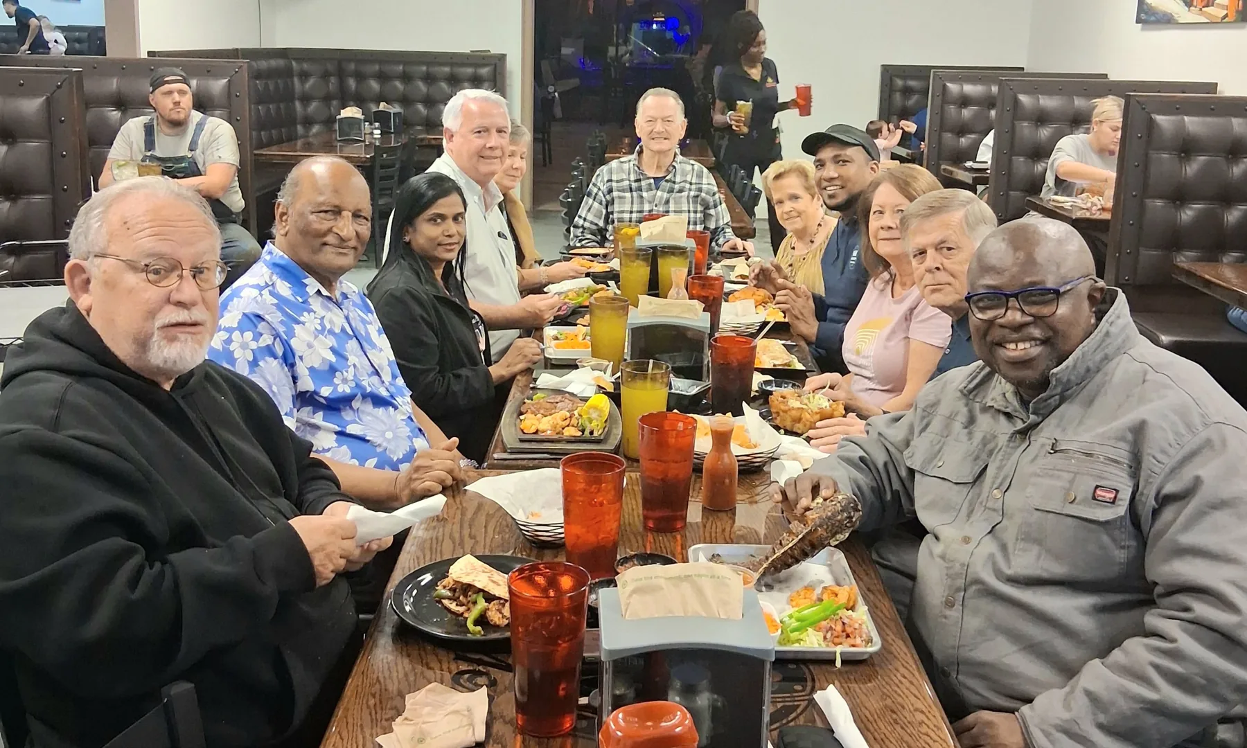 Abel Govender sharing a meal with leaders in the United States