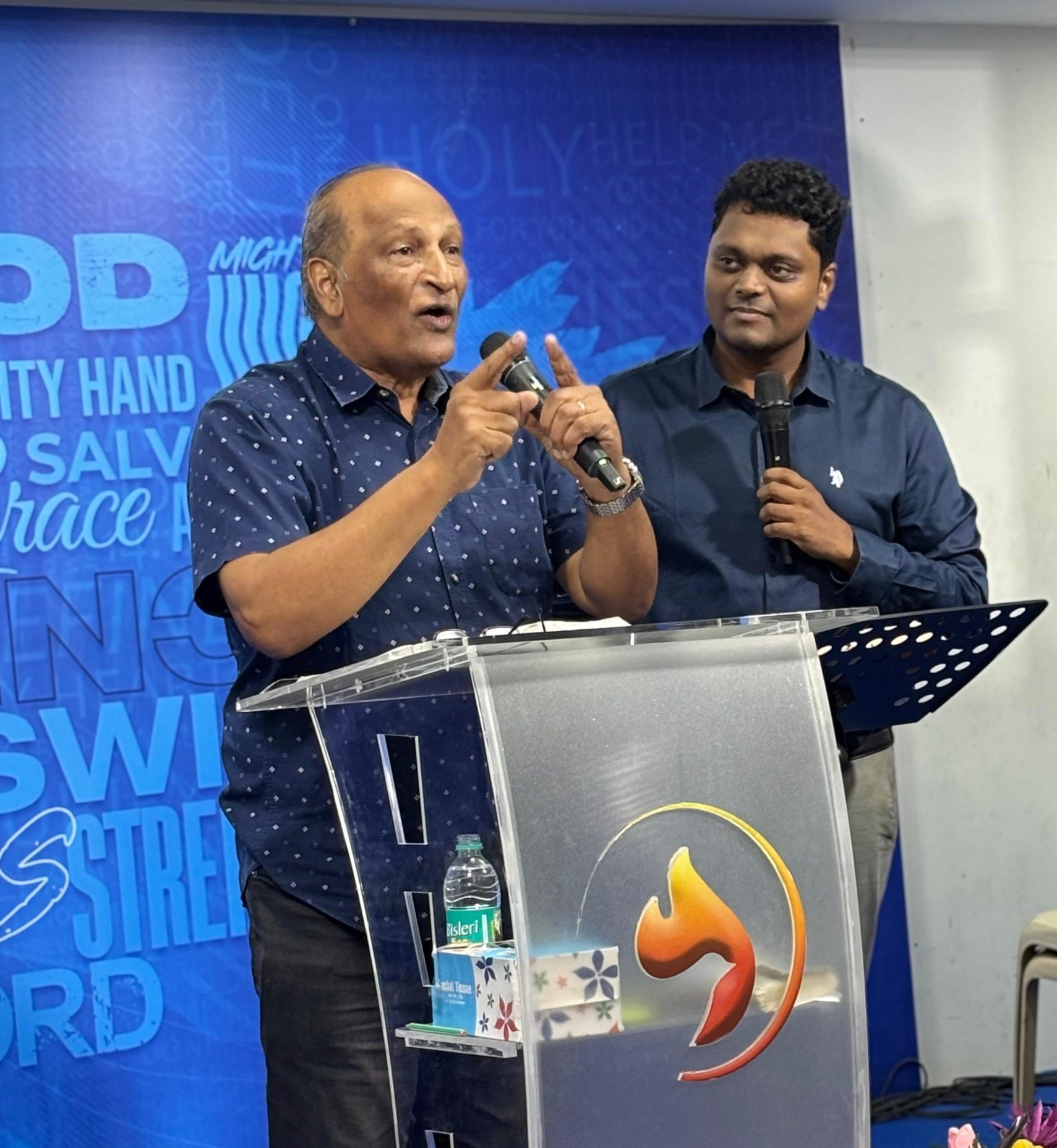 Abel Govender preaching at a gathering in India